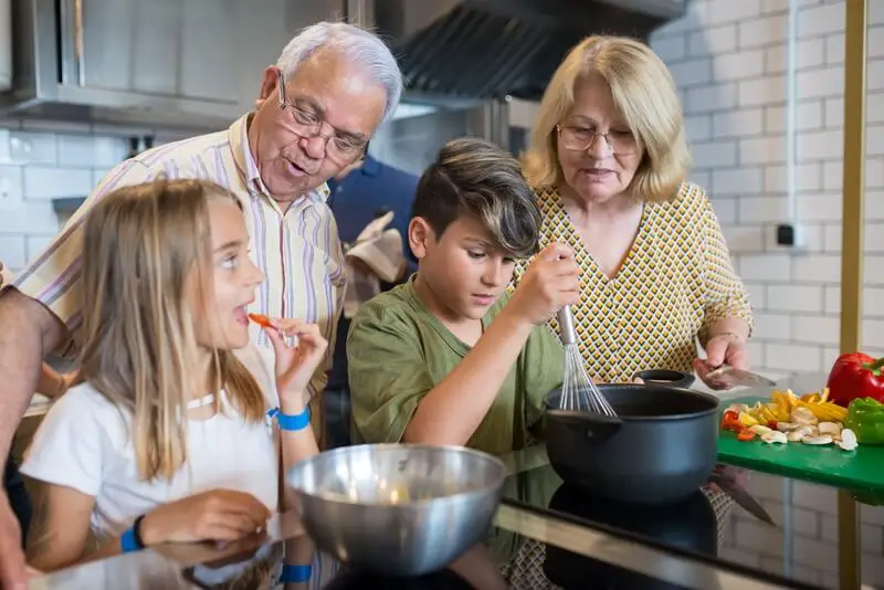 A chef expertly plating a delicious meal, demonstrating the real-world application of skills learned through online cooking courses.