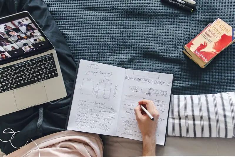 Laptop, tablet, and smartphone connected to a colorful network of knowledge, representing the diverse gadgets used for online learning.