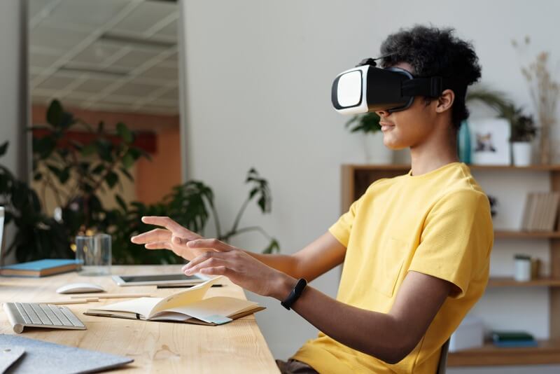 A student immersed in a virtual reality classroom, interacting with holographic lessons and 3D objects, illustrating the future of interactive learning.